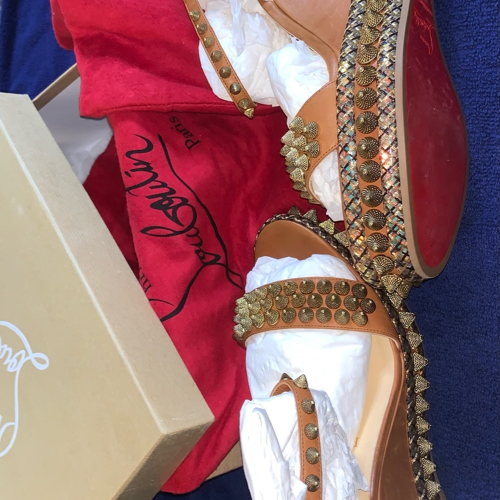 Authentic christian louboutin wedges size 41 runs small